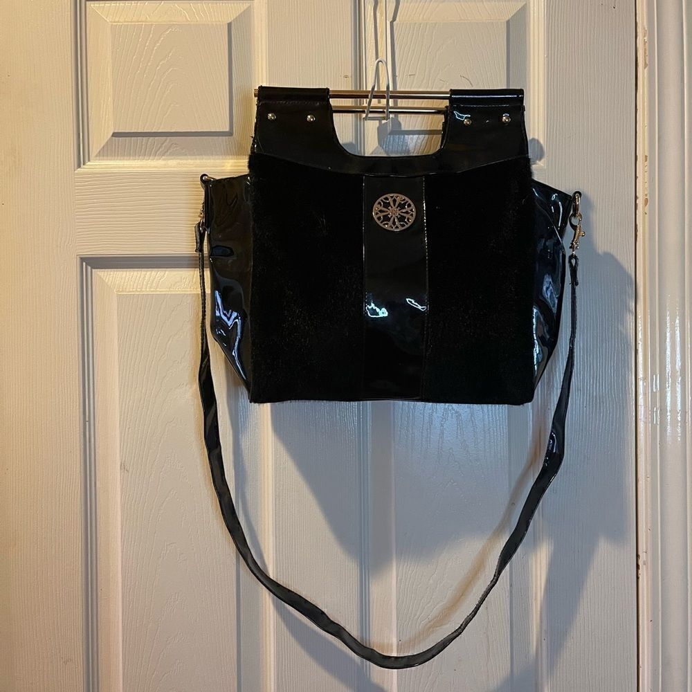 Avon the collection black velour and patent handbag bag with gold accents.